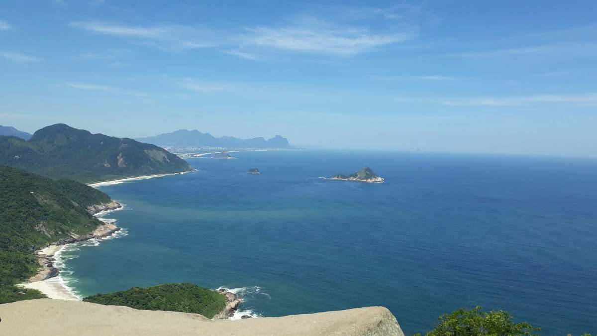 rio de janeiro green island in the middle of blue sea under blue sky during daytime rj